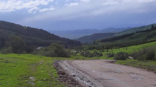 The Road Among The Mountain Landscapes
