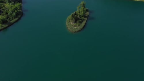 Serene Waters Of Bacina Lakes Surrounding The Islet With Lush Green Trees In Dalmatia, Croatia. - ae