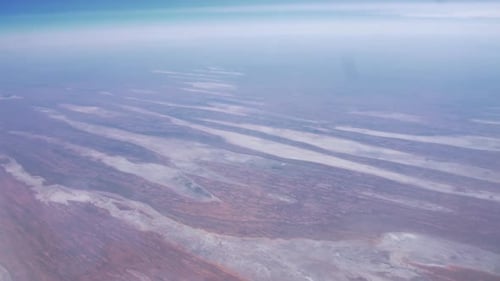 Landscape View From Airplane Window In Flight From Australia To Singapore. high angle shot, POV