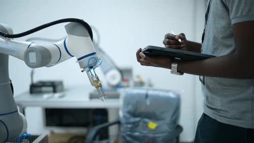 Trainee Robotics engineer learning with Programming and Manipulating Robot Hand