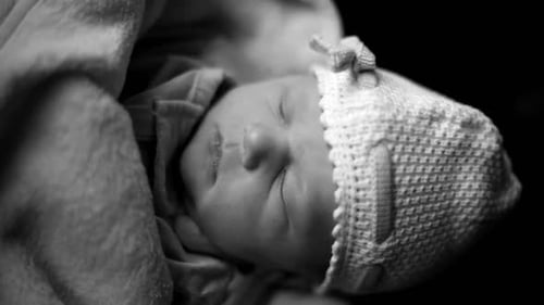 Close up of Adorable Newborn Baby Sleeping Peacefully