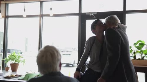 Happy Senior Father Hugging Daughter in Cafe Active Seniors