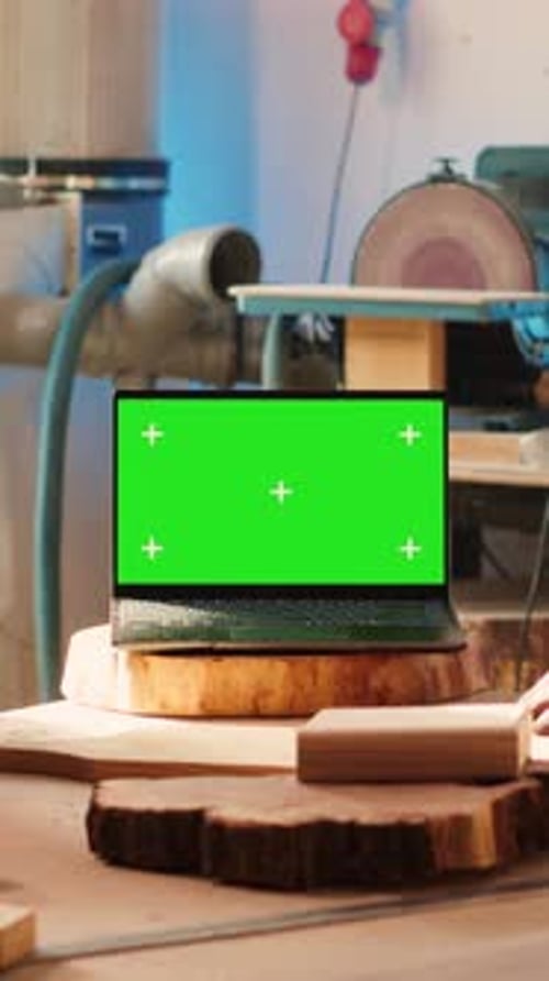 Vertical Video Joyous Cabinetmaker Look Over Blueprints Schematics on Isolated Screen Laptop