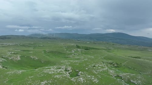 Aerial View of Countryside Landscape Clouds with Shades of Purple Orange and Green Vegetation