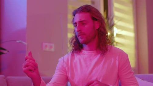 Man Using Transparent Touchscreen Device in Modern Home