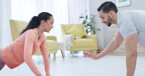 Couple Exercising Doing Push-Ups Together at Home