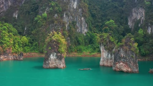 Three limestone rocks Three Brothers at Cheow Lan Lake, Khao Sok National Park, Surat Thani Province