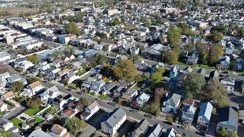 Aerial View of a Suburban Neighborhood Showcasing Homes and Streets in Autumn
