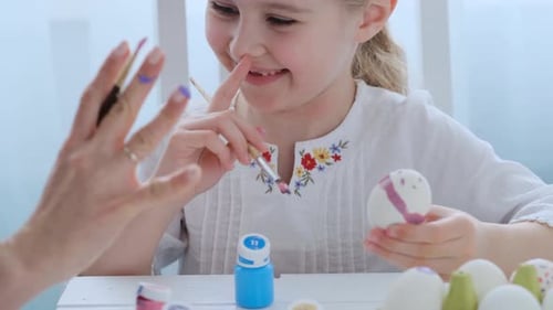Little Girl is Enjoying Preparing for Easter