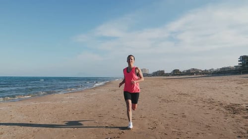Running on seashore. Front view