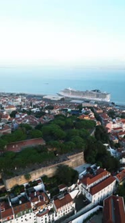 Aerial video in the center of the old city of Lisbon, with the Tagus River in the background