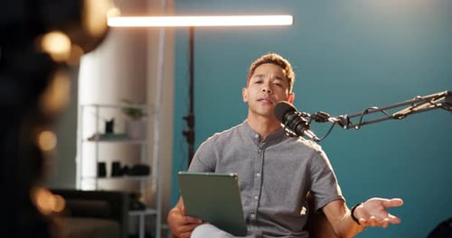 Influencer, microphone and podcast with man and tablet for live streaming