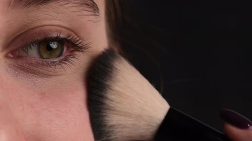 Professional Makeup Applying Face Powder With Cosmetic Powder Brush Close Up Shoot