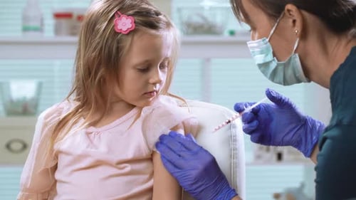 Young Girl Gets Vaccine at Doctor's Office