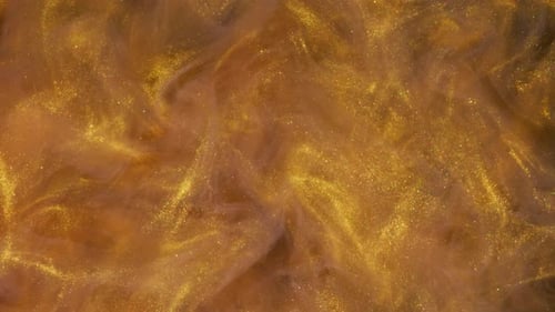 Abstract Gold Metallic Paint Motion Background