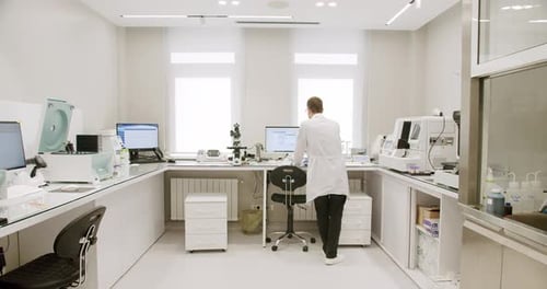 Scientist Working in a Brightly Lit Laboratory