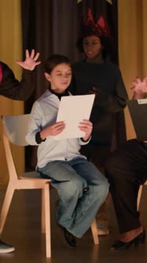 Theater Director And Child Actors During Rehearsal