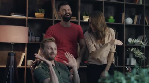 Colleagues Celebrate Success in Office with High Fives