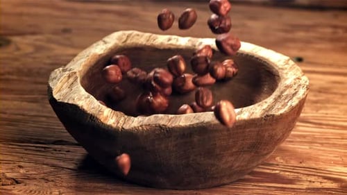 Hazelnuts Fall Into a Wooden Bowl Filmed on a Highspeed Camera at 1000 Fps