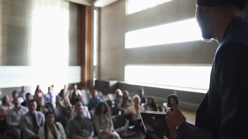 Speaker Presents to Audience at Corporate Event