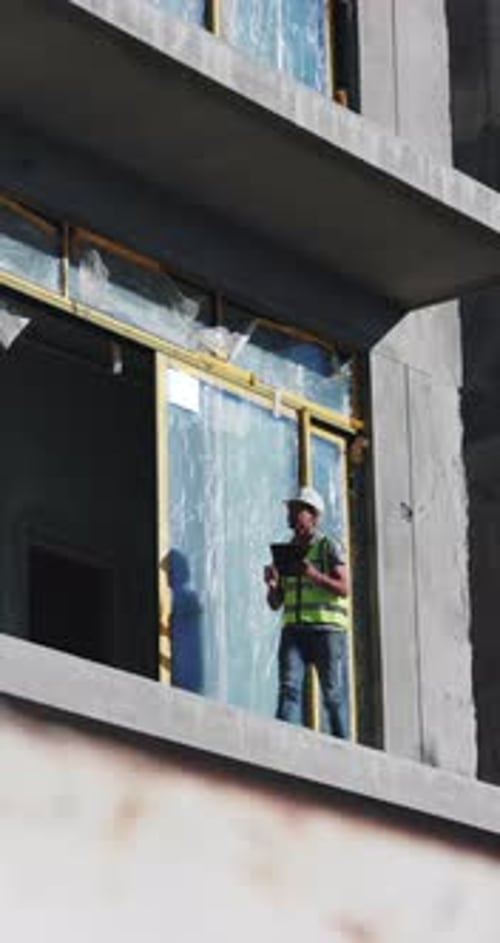Construction, walking and man on tablet in building for urban planning, research and blueprints