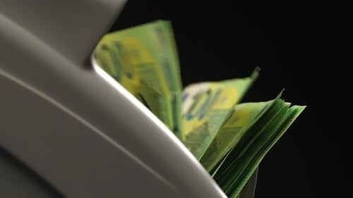 Euro Bills Being Counted by Machine