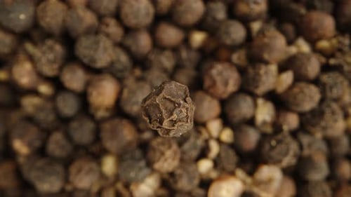 Close up footage of pile of peppercorns