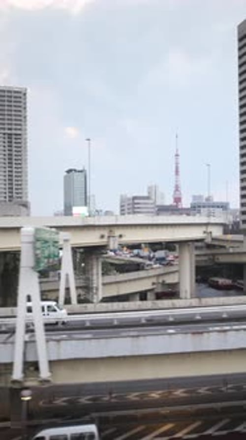 Tokyo Monorail Passing Through the City's Skyscapers in Vertical
