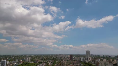 Timelapse over the city, clouds and daylight with drone