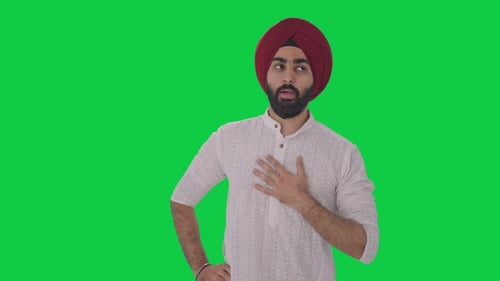 Sick Sikh Indian man having an Asthma attack Green screen