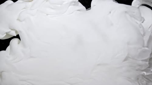 Billowing White Substance on Black Background