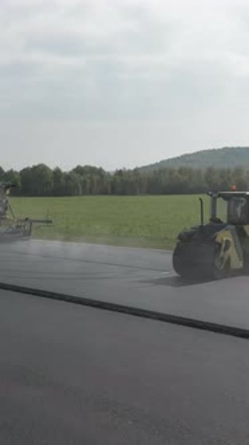 Road Roller Flattening Fresh Asphalt on a New Road Clip