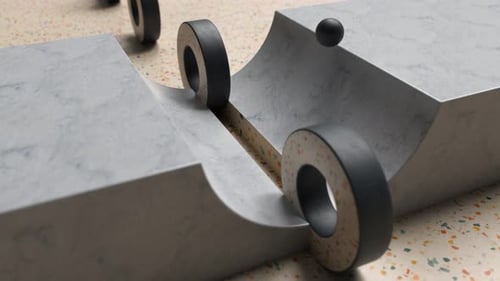 Abstract Loop Rubber wheels on ramp with sphere interaction, showcasing movement.