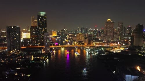 Skyscrapers in Bangkok City and River at Night