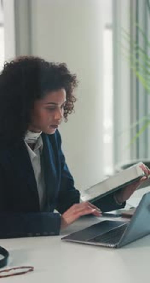 Tablet, reading and businesswoman with laptop in office for finance report with stock market