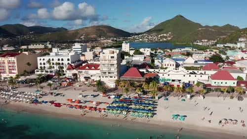 Close-up low panning aerial shot of the beachfront in Philipsburg, Saint Maarten. 4K