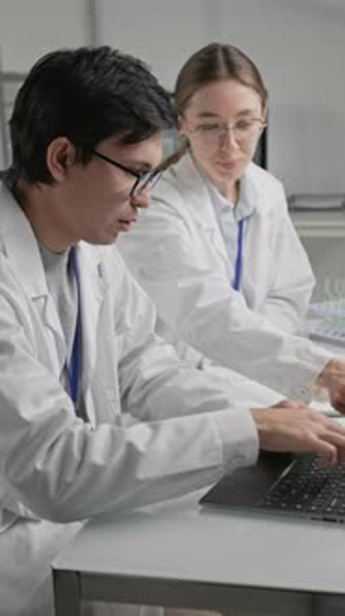 Scientists Working Together in Laboratory Setting