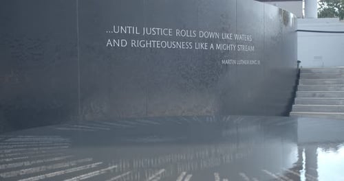 Quote on Justice at Monument with Water Feature