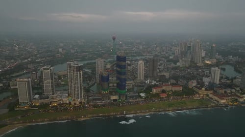 Amazing Aerial Footage of Modern High Rise Buildings on Sea Coast at Dusk Panoramic View of City
