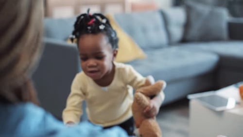 Young girl hugging her mother at home