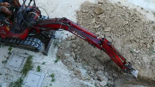 Excavator Digging Trench Seen From Above