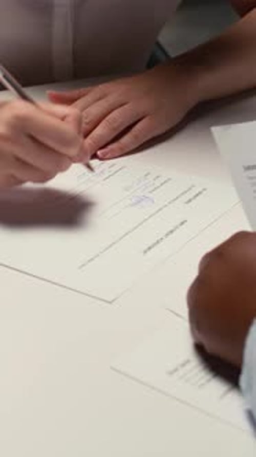 Vertical Video Close Up of Job Seeker Signing a Work Contract After Successful Interview