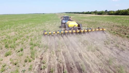 Blue Tractor O.A. Planting Canola On No Till Field