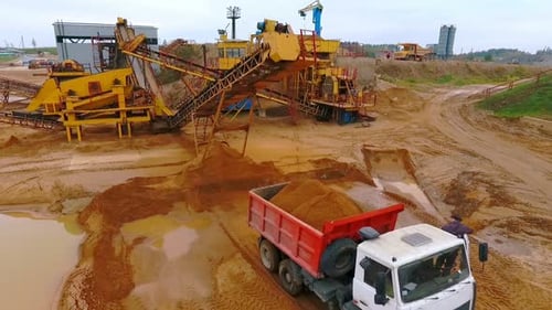 Mining Conveyor Pour Sand In Dumper Truck. Mining Equipment Working At Sand Mine. Industrial Conv...
