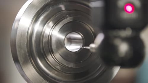 Close up of coordinate measurement machine CMM for high precision part inspection during prosuction