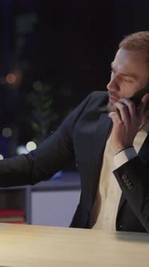 Bearded Young Handsome Confident Guy Calling to Boss Employer Quitting Job and Leaving the Office