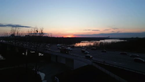 Aerial view. Sunset over a bridge with busy car traffic