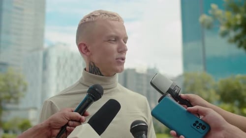 Young Adult Giving Interview in the City