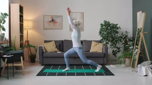Active Senior Woman Doing Yoga at Home