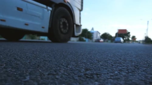 Blurred Cars Go One By One on the Road Vehicles Drive Along Asphalt Road Traffic in Highway Bottom